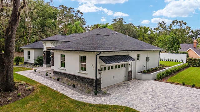 view of front of house featuring a front yard and a garage