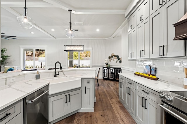 kitchen with exhaust hood, sink, gray cabinets, dark hardwood / wood-style flooring, and stainless steel appliances