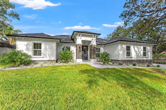 prairie-style house featuring a front lawn