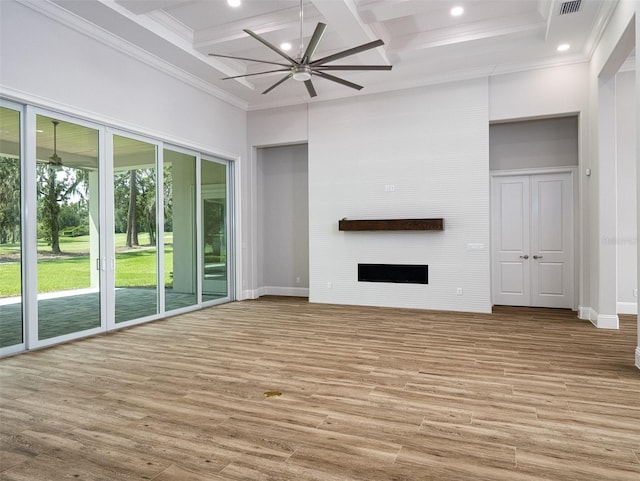 unfurnished living room with hardwood / wood-style flooring, coffered ceiling, beamed ceiling, and ceiling fan