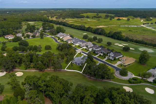 drone / aerial view featuring golf course view and a residential view