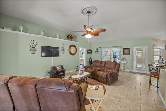 living room featuring vaulted ceiling, ceiling fan, and light tile patterned flooring