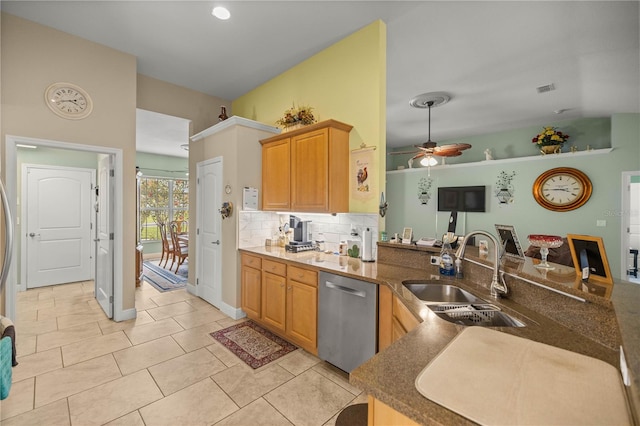 kitchen featuring ceiling fan, sink, stainless steel dishwasher, backsplash, and light tile patterned floors