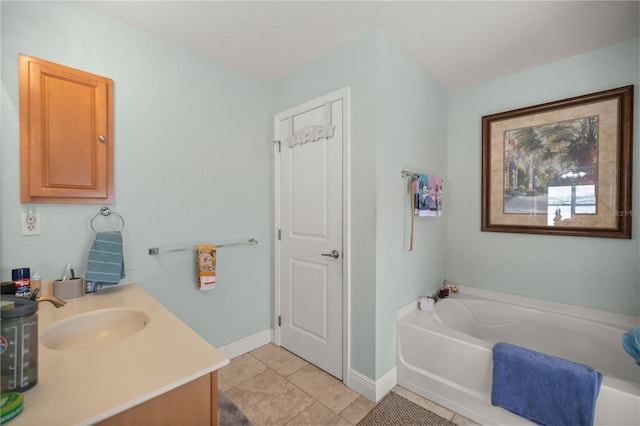 bathroom featuring a bath, vanity, and tile patterned floors