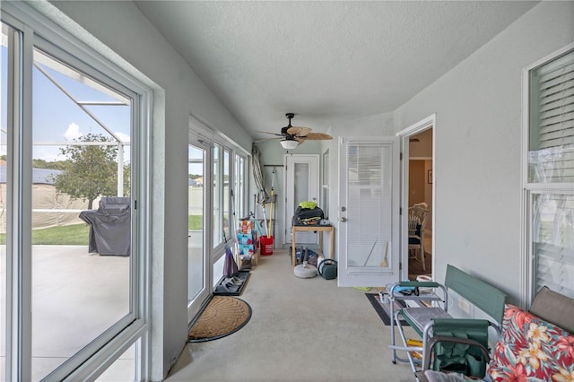 sunroom / solarium with ceiling fan