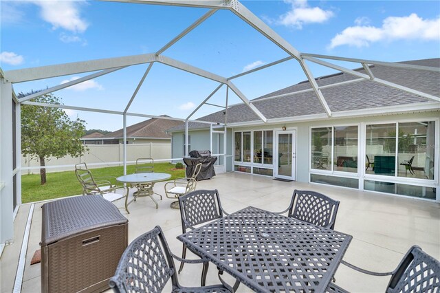 view of patio featuring a lanai and area for grilling