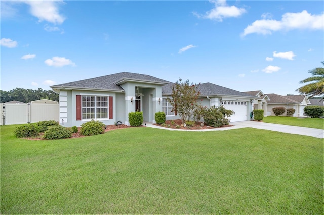 single story home with a garage and a front lawn