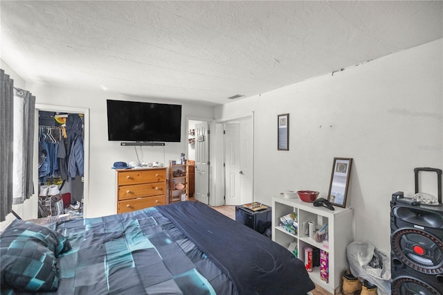 bedroom featuring a closet and a textured ceiling