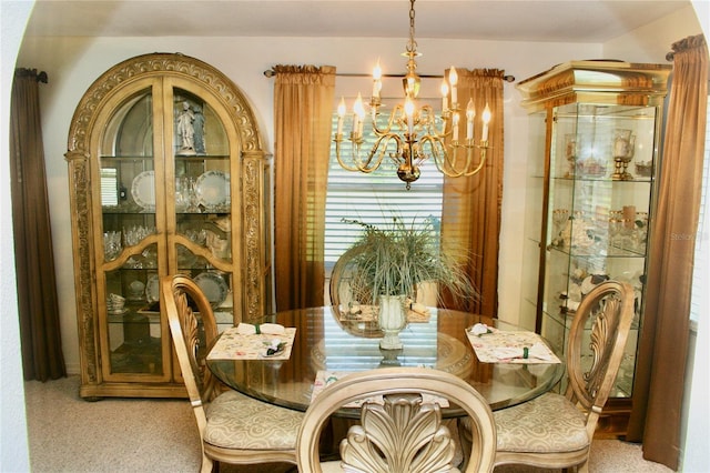 carpeted dining room with a notable chandelier