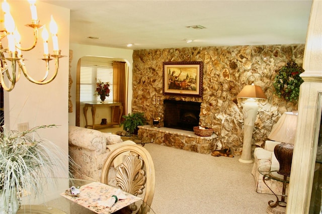 living room featuring a fireplace and carpet