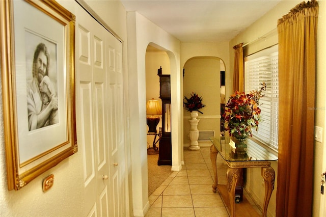 corridor featuring light tile patterned floors