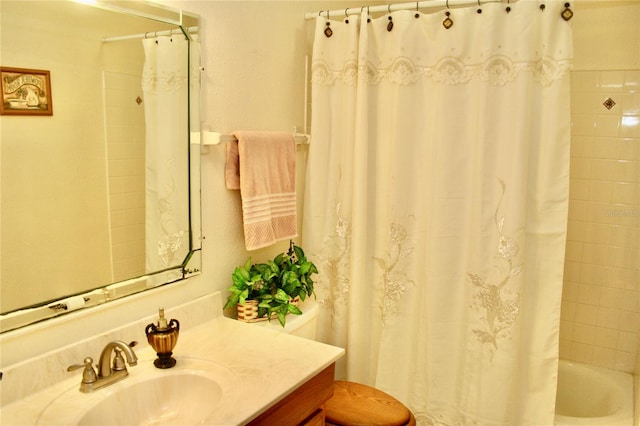 bathroom featuring shower / bathtub combination with curtain and vanity