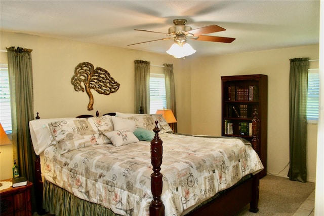 tiled bedroom with ceiling fan