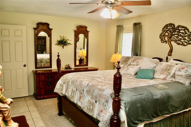 tiled bedroom featuring ceiling fan