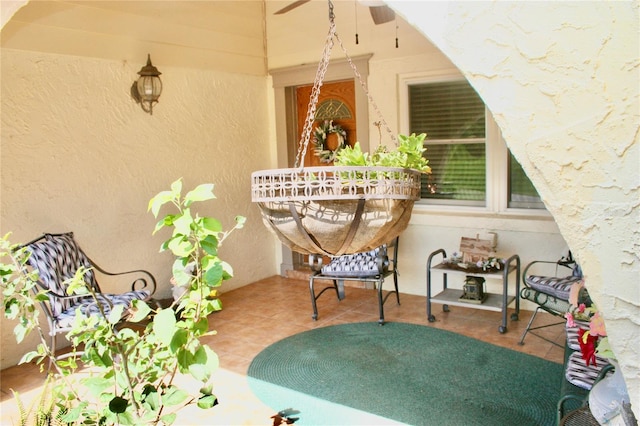 exterior space with ceiling fan