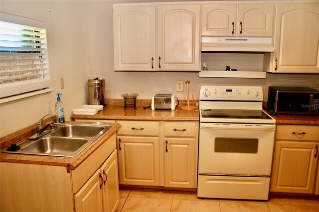 kitchen featuring white range with electric cooktop, sink, and light tile patterned floors