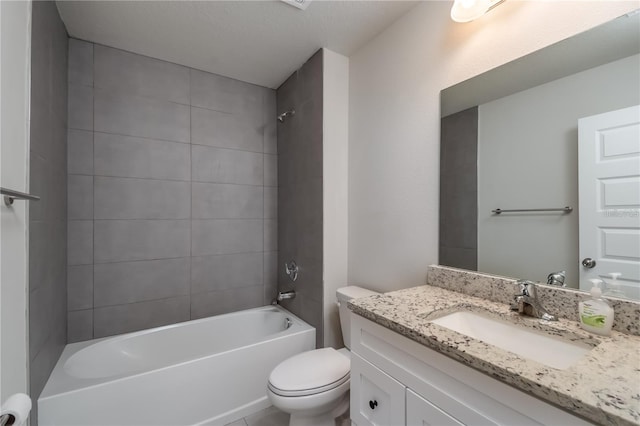 full bathroom featuring vanity, toilet, and tiled shower / bath