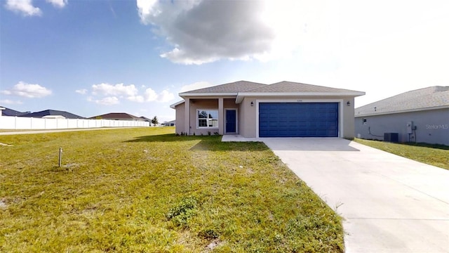 view of front of home featuring a front yard, a garage, and central air condition unit