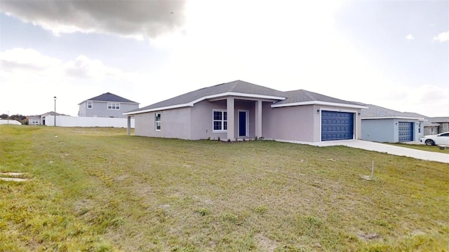 single story home with a garage and a front lawn