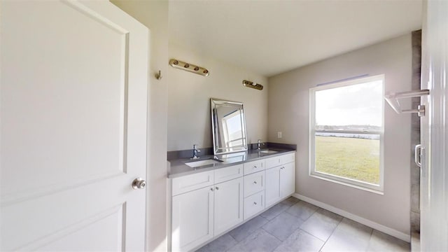 bathroom with vanity and tile patterned floors