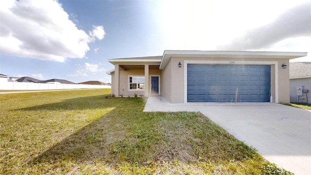 ranch-style house featuring a garage and a front lawn