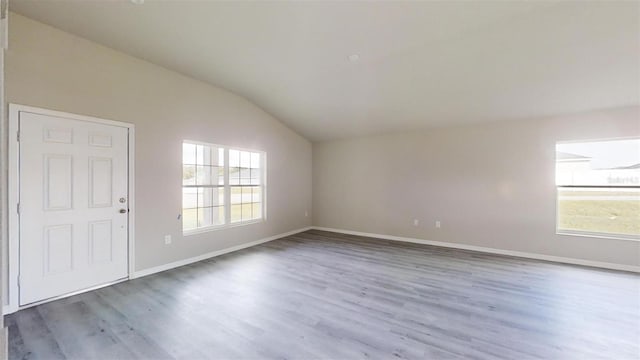 entryway with dark hardwood / wood-style floors and vaulted ceiling