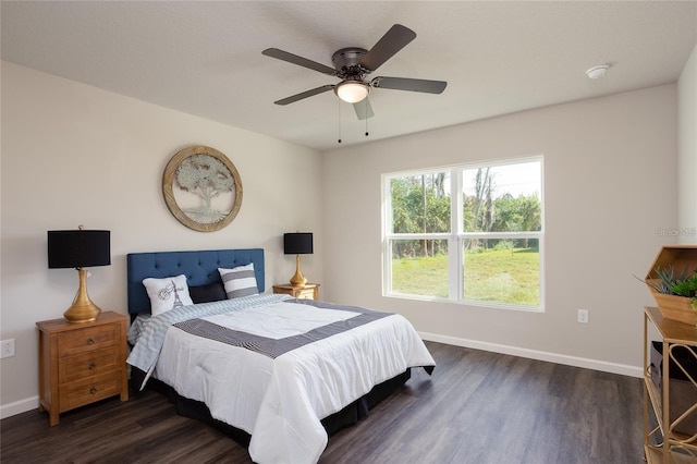 bedroom with ceiling fan and dark hardwood / wood-style flooring