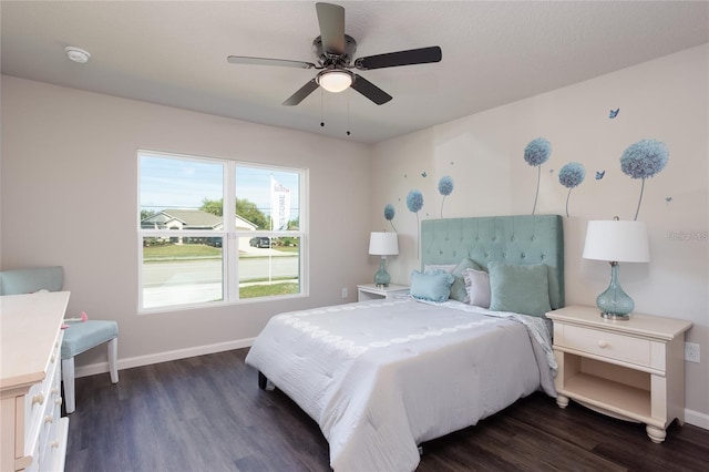 bedroom with ceiling fan and dark hardwood / wood-style floors