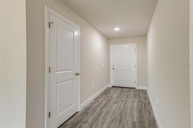 hall with light wood-type flooring