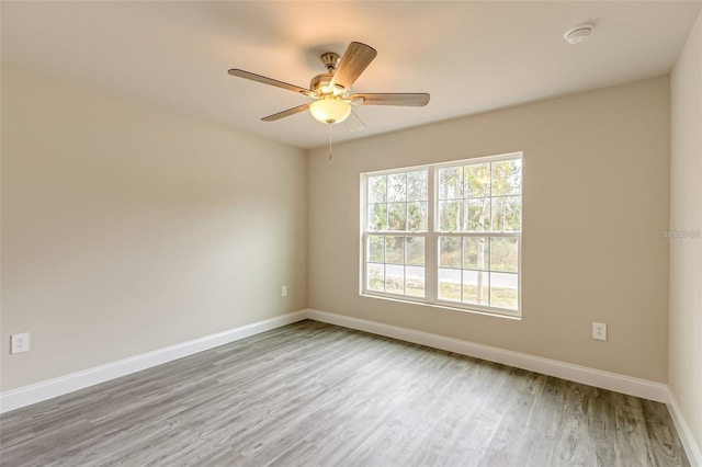 empty room featuring ceiling fan and wood-type flooring