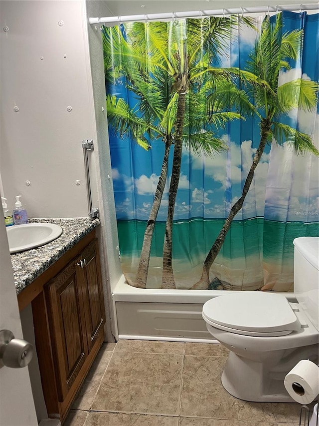 full bathroom with vanity, shower / bath combo, and toilet