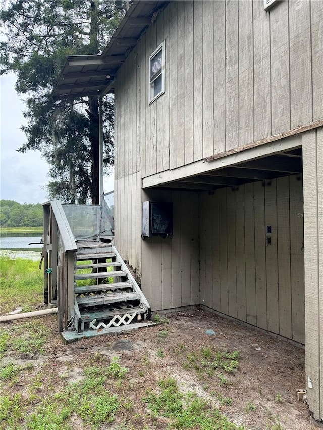 view of property exterior with a water view