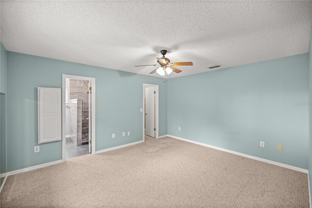 unfurnished room featuring a textured ceiling, carpet flooring, and ceiling fan