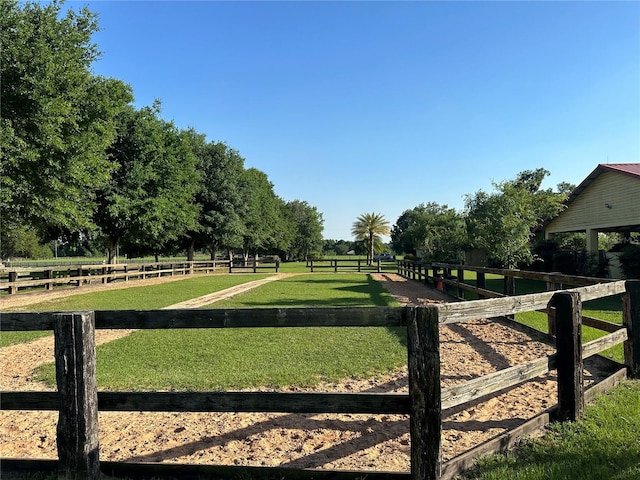 view of yard with a rural view