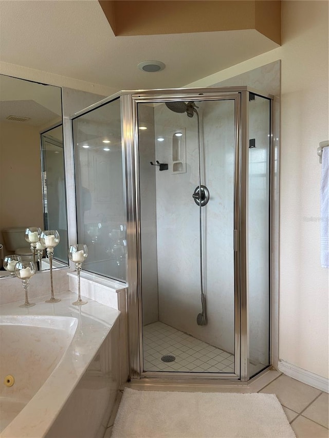 bathroom with tile patterned floors and plus walk in shower