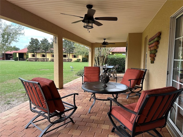 view of patio featuring ceiling fan