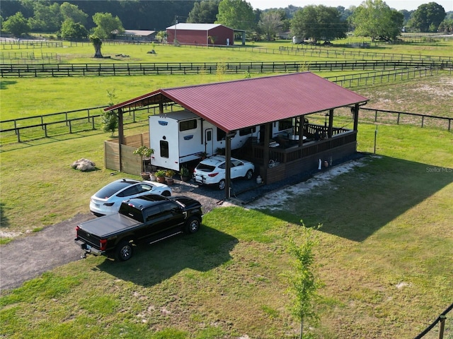 birds eye view of property with a rural view