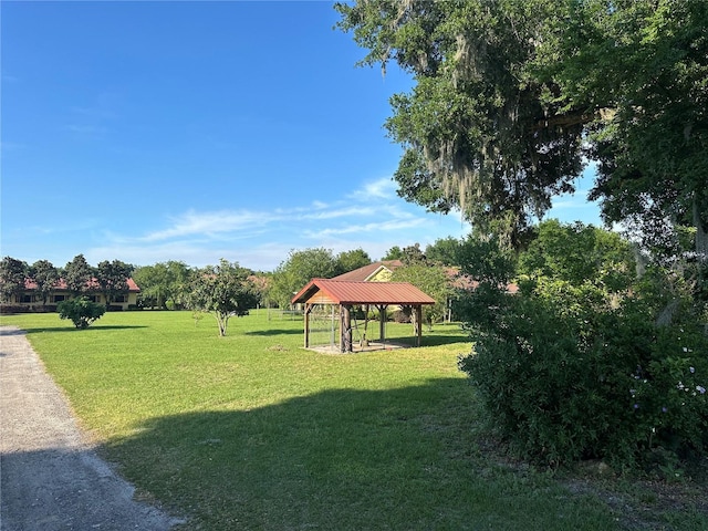 view of home's community with a gazebo and a lawn