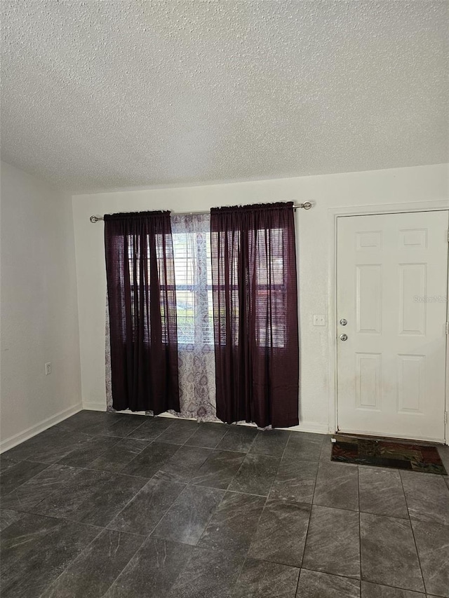 foyer featuring a textured ceiling