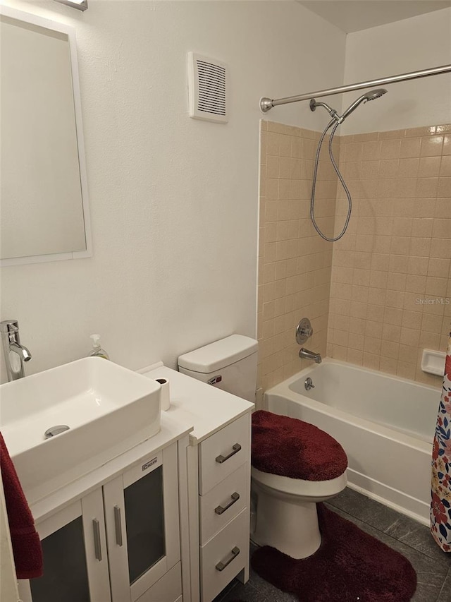 full bathroom featuring vanity, shower / tub combo, toilet, and tile patterned floors