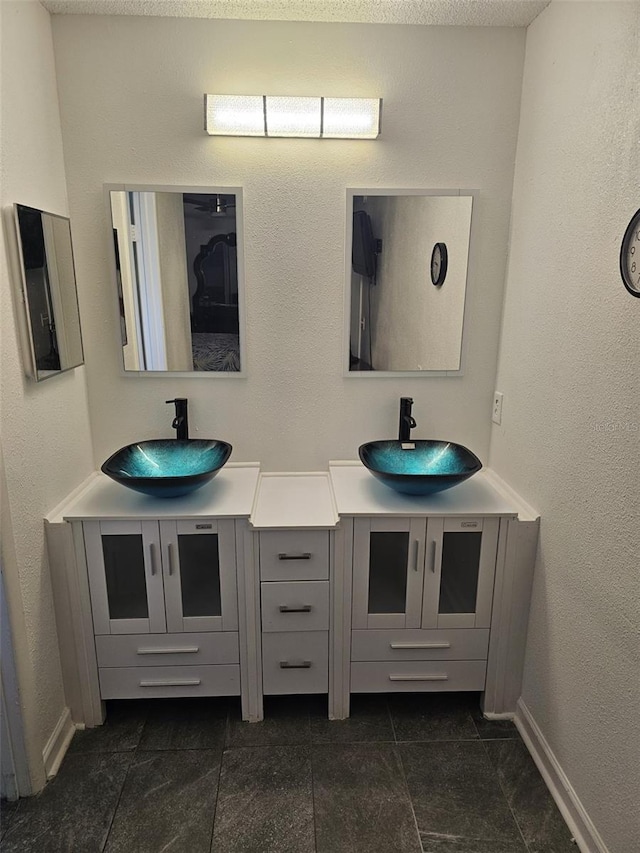 bathroom featuring vanity and tile patterned flooring