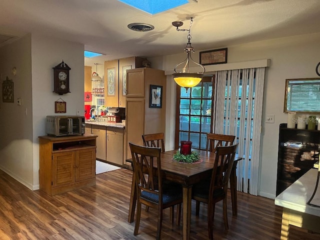 dining room featuring dark wood-type flooring