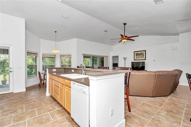 kitchen with dishwasher, a breakfast bar area, open floor plan, a kitchen island with sink, and a sink