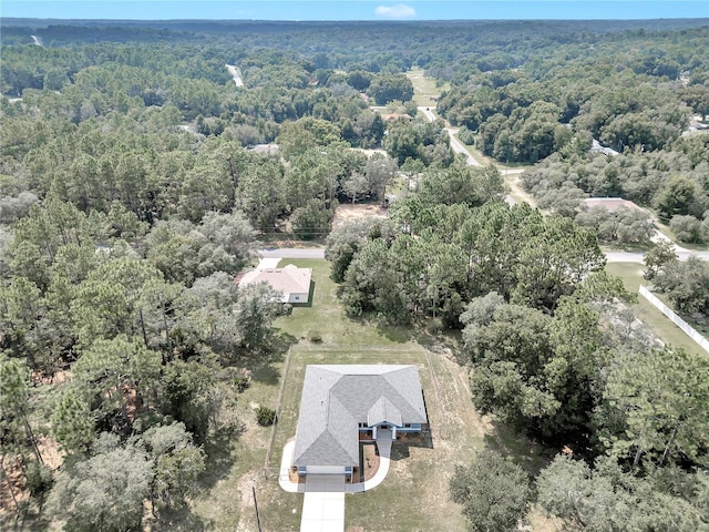 aerial view featuring a view of trees