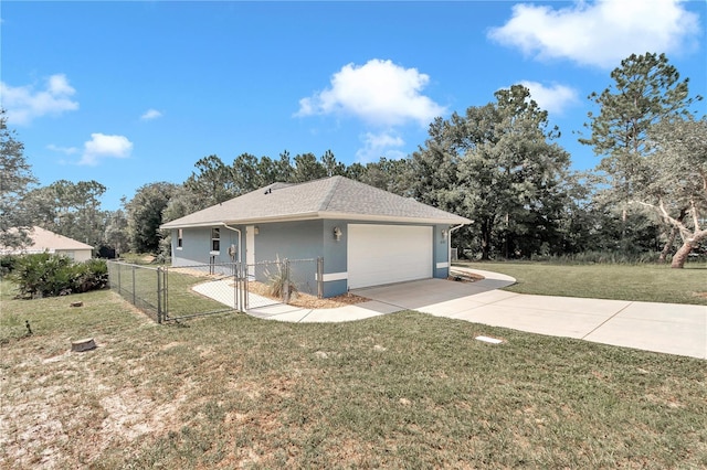 view of property exterior with a garage, fence, driveway, a lawn, and stucco siding