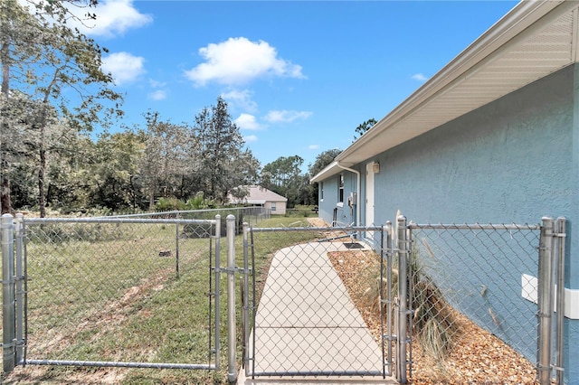 view of yard with a gate and fence