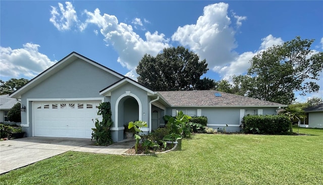 ranch-style house with a garage and a front lawn