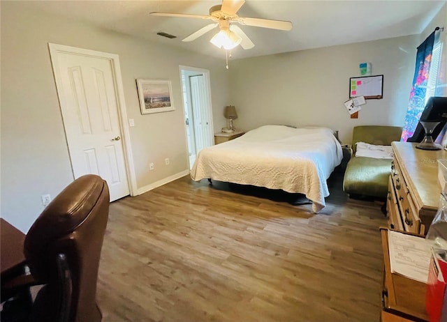 bedroom featuring ceiling fan and wood-type flooring