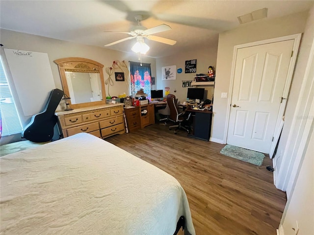 bedroom with hardwood / wood-style floors and ceiling fan