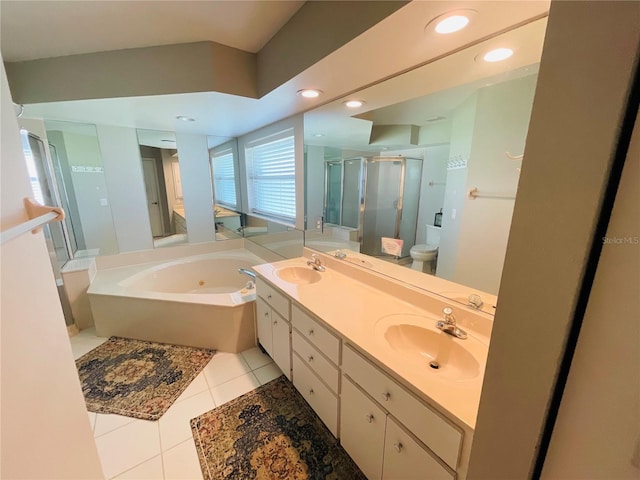 full bathroom featuring vanity, toilet, plus walk in shower, and tile patterned floors